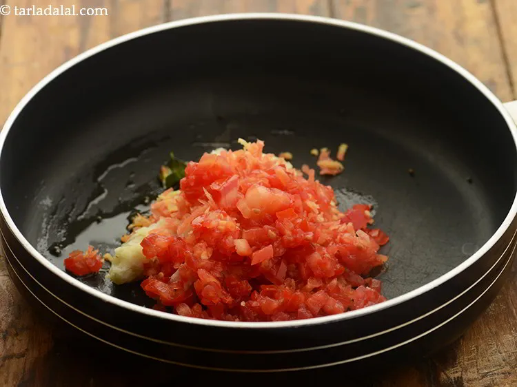 Step 23 – Add finely chopped tomatoes.