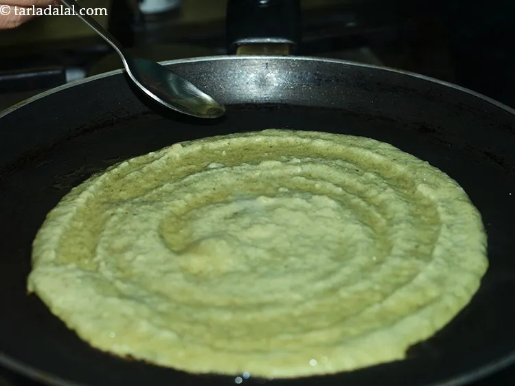 Step 36 – Smear &frac12; tsp of oil around the edges and cook on a medium flame till …