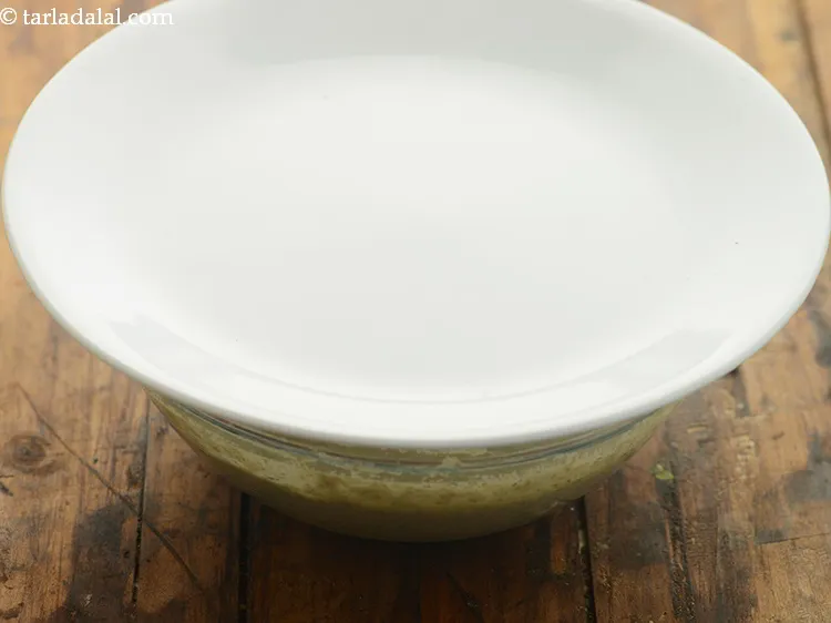 Step 15 – Cover the batter of <strong>healthy sprouts dosa</strong> with a lid and keep aside for 15 …