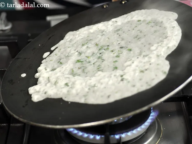 Step 33 – Lightly tilt the tava immediately to make approx. 150 mm. (6&rdquo;) diameter circle.