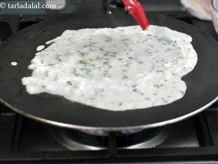 Step 34 – Smear 2 tsp oil on it and along the edges. Ghee/Butter can also be used …