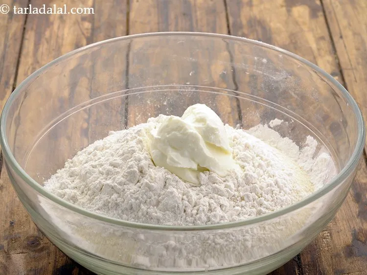 Step 14 – Add curds. We have used <a href="https://www.tarladalal.com/Fresh-Curds-(-Low-Calorie-Healthy-Cooking-)-1321r" target="_blank">homemade curd</a> which will enhance the flavour of …