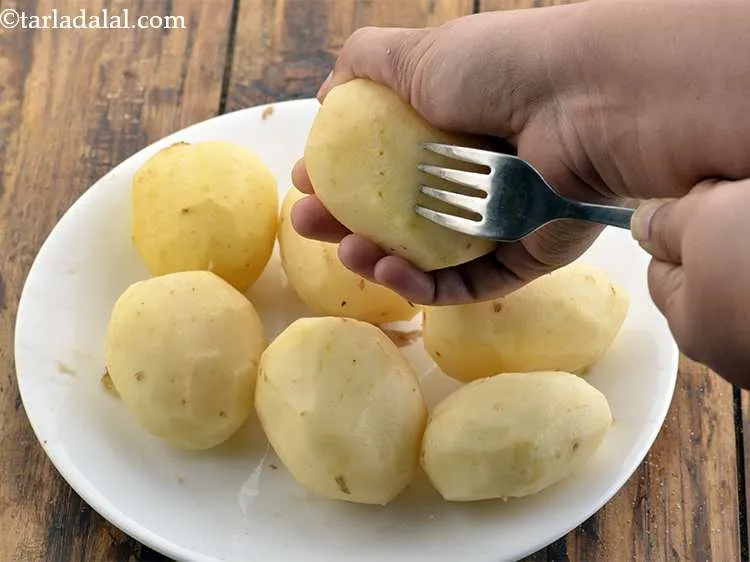 Step 4 – Prick potatoes at a few places with the help of a fork. This ensures that …