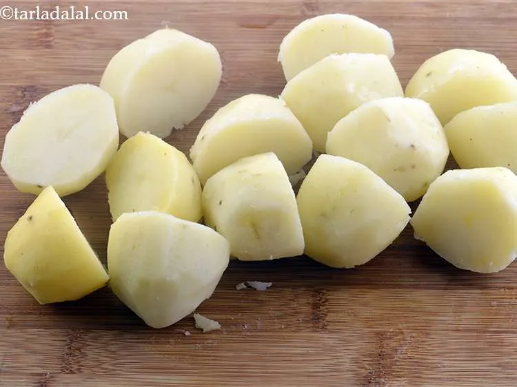 Step 9 – Cut the potatoes into halves.