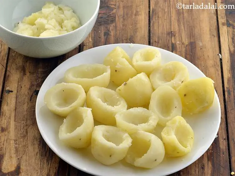 Step 10 – Scoop the potatoes with the help of a peeler or a melon baller. Reserve the …