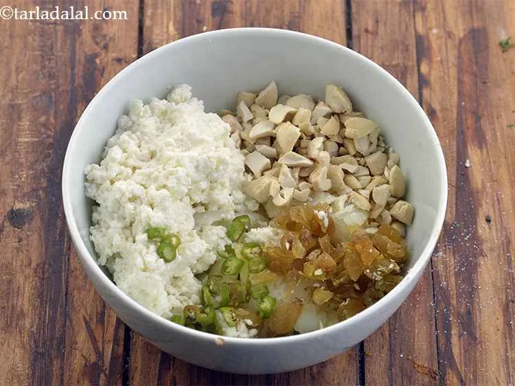 Step 17 – Now add the green chillies to the stuffing mixture to make it more flavorful.