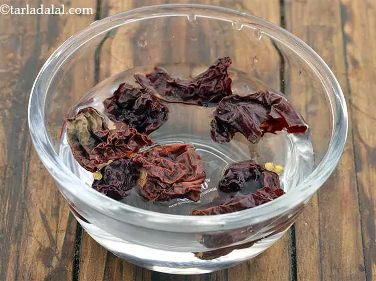 Step 23 – Put the chillies into it.