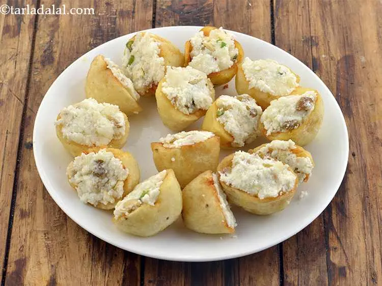 Step 20 – Fill each potato half with the stuffing. Keep them aside on a plate.