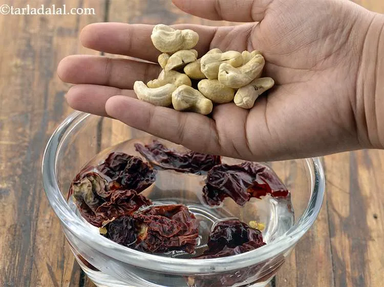 Step 24 – Now, add the cashew nuts into it and keep aside for about 1 hour. Kaju …