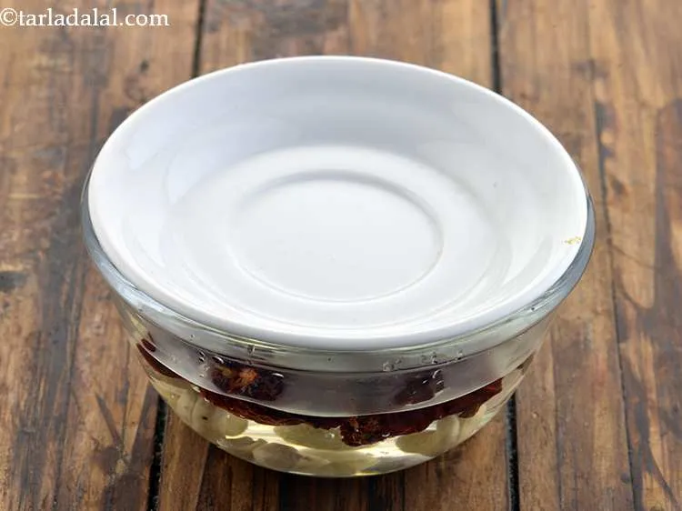 Step 25 – Cover and soak the chillies and kaju for an hour.