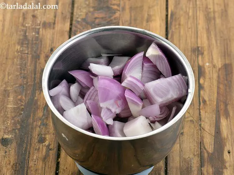 Step 27 – To make the paste for your <strong>Mughlai Dum Aloo gravy</strong>, take a medium sized mixer …