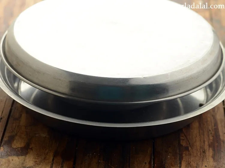 Step 44 – Cover with a lid and keep aside to ferment overnight. Remember in winter season, it …