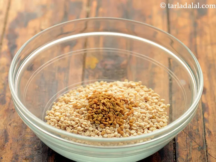 Step 31 – Add 1 tsp&nbsp;<a href="https://www.tarladalal.com/glossary-fenugreek-seeds-methi-dana-methi-ke-dane-methi-seeds-991i">fenugreek (methi) seeds</a> to it. This helps in fermentation.&nbsp;