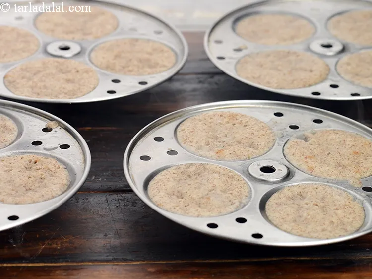 Step 51 – Steam in an idli steamer for 10 minutes or till they are cooked.