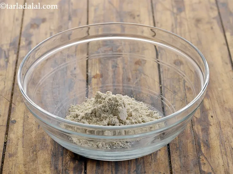 Step 2 – For the dough of <strong>multigrain vegetable roti</strong>, in a deep bowl, take jowar flour. Read …