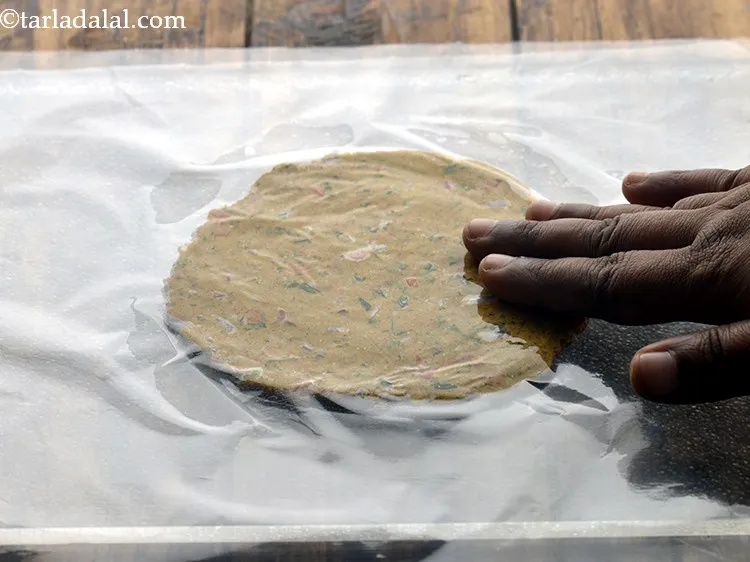 Step 21 – Lightly press on the plastic sheet evenly to make a 100 mm. (4&rdquo;) diameter round.