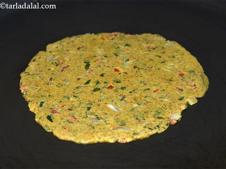 Step 23 – Heat a non-stick tava (griddle). Before placing the roti on the tava, remove the other …