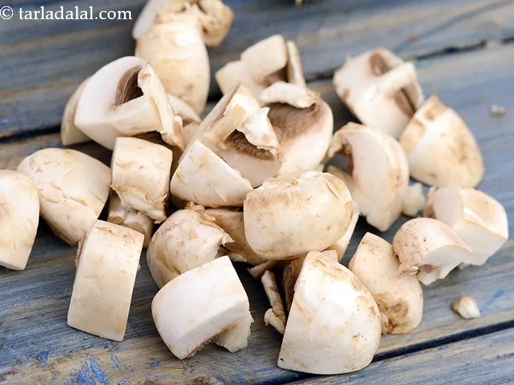 Step 8 – Add 4 cups&nbsp;<a href="https://www.tarladalal.com/glossary-mushroom-cubes-2282i">mushroom (khumbh) cubes</a>.