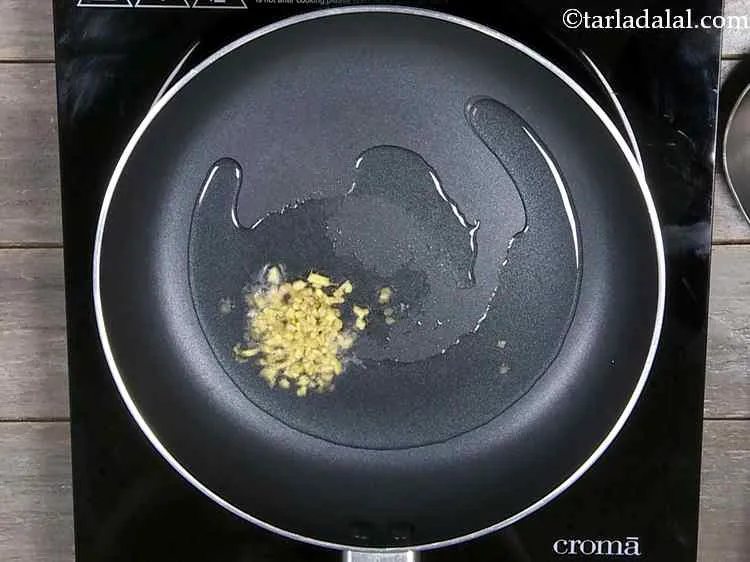 Step 24 – Heat the oil is a broad non-stick pan and add the ginger. The earthy tang …