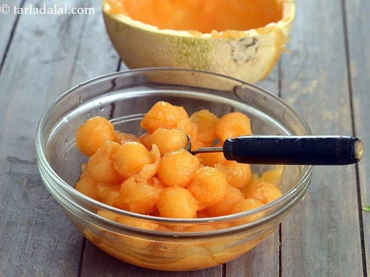 Step 10 – Put 10 <a href="https://www.tarladalal.com/glossary-muskmelon-balls-kharbooja-balls-1143i">muskmelon (kharbooja) balls</a> in each glass.