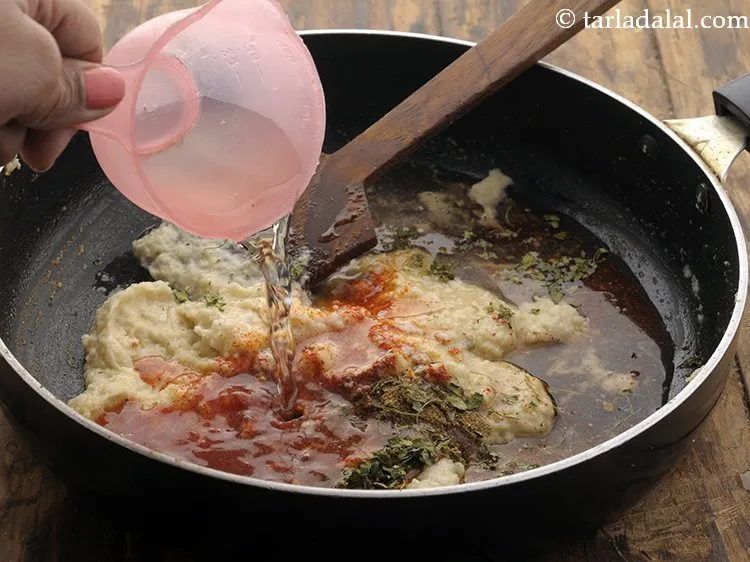 Step 16 – Add &frac12; cup of water to prevent the masala from burning