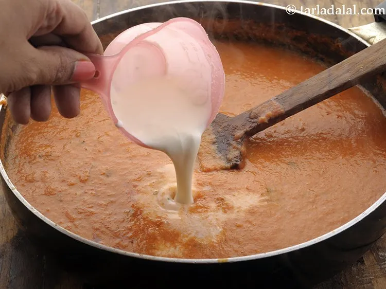 Step 23 – Add fresh cream. It provides a rich and creamy texture to the Paneer Matar Makhani …