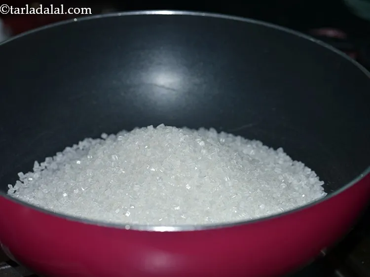 Step 6 – Meanwhile to make sugar syrup for <strong>Mysore Pak, </strong>add the sugar in a deep non-stick …