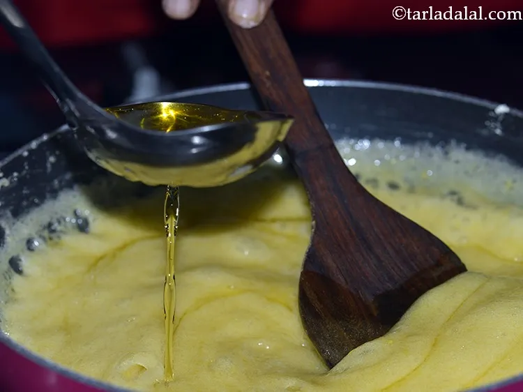Step 14 – Now to continue making <strong>S</strong><strong>oft Mysore Pak recipe</strong>, increase the flame from low to medium …