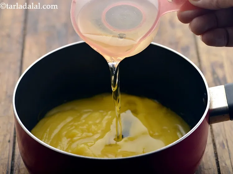 Step 4 – Pour the ghee and oil in a non-stick sauce pan.