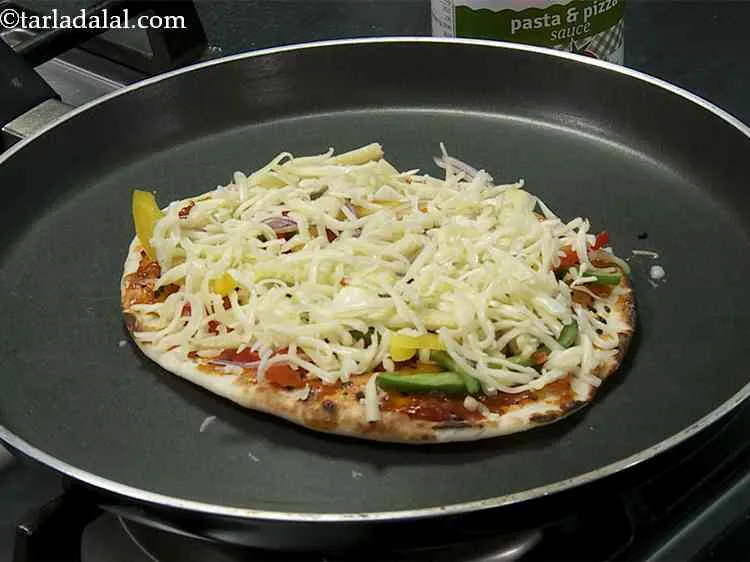 Step 22 – Sprinkle ? cup of grated cheese evenly over it.