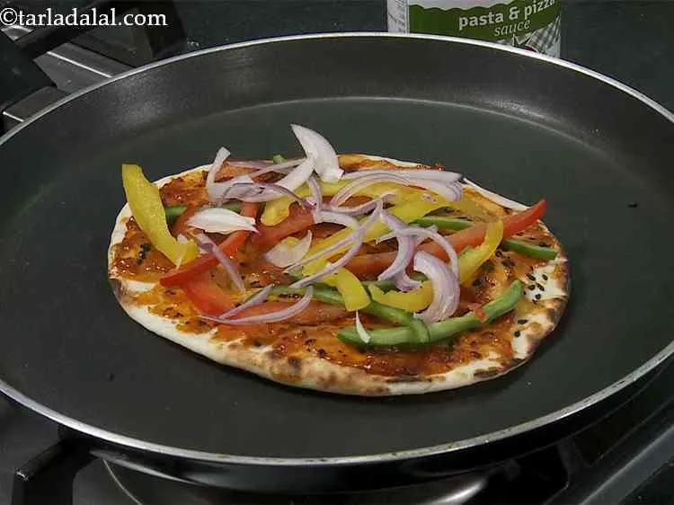 Step 20 – Now arrange sliced onions on top of the coloured capsicum.