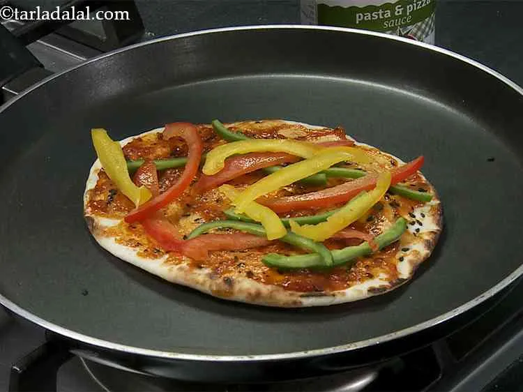 Step 19 – Arrange little sliced colored capsicums on the base.