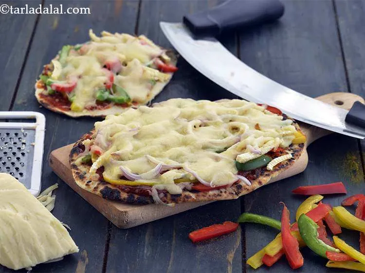 Step 25 – Cut into equal wedges and serve&nbsp;<strong>Indian naan pizza | veg naan pizza | tava nanza …