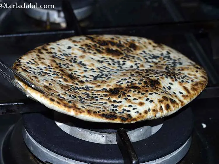 Step 16 – Roast it on an open flame till it turns golden brown from both the sides. …