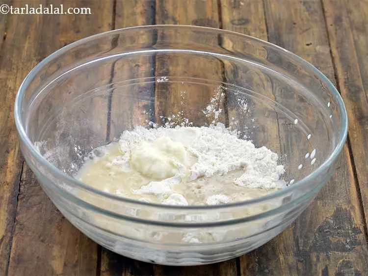 Step 5 – Add the yeast-sugar mixture to the above bowl.