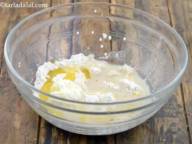 Step 6 – Add the melted ghee to the same bowl.