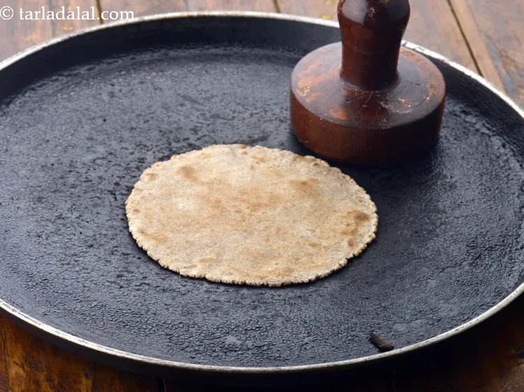 Step 17 – Cook on a slow flame until crisp using little pressure with help of a khakhra …