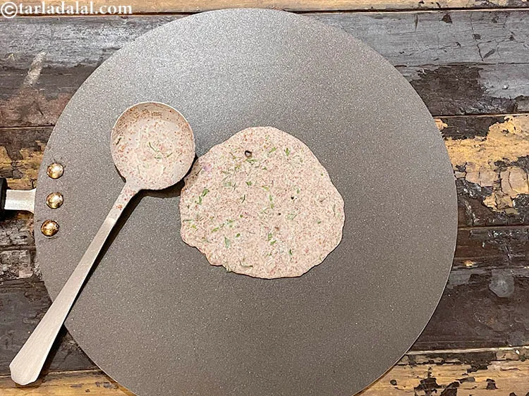 Step 18 – <meta charset="UTF-8" />Pour a ladelful of the batter on it and rotate the ladle in …