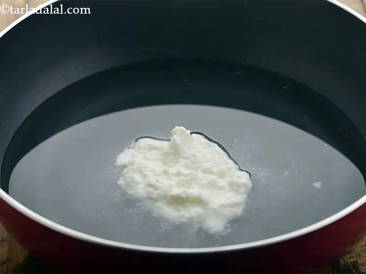 Step 3 – Add 2 tablespoons of curds.