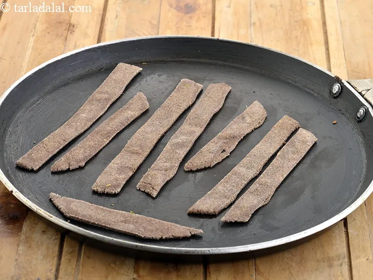 Step 9 – Heat a non-stick tava (griddle) and cook the strips, a few at a time.