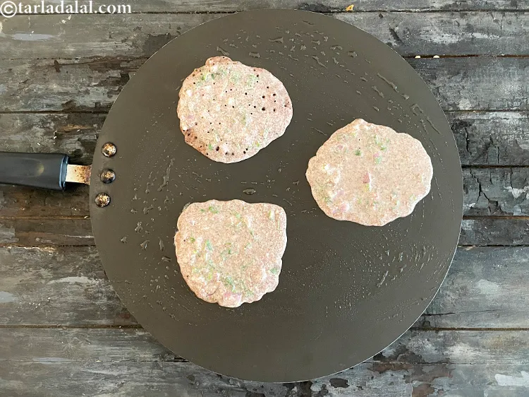 Step 34 – <meta charset="UTF-8" />Pour the jowar pancake batter over the greased hot dosa tava. &nbsp;You would …