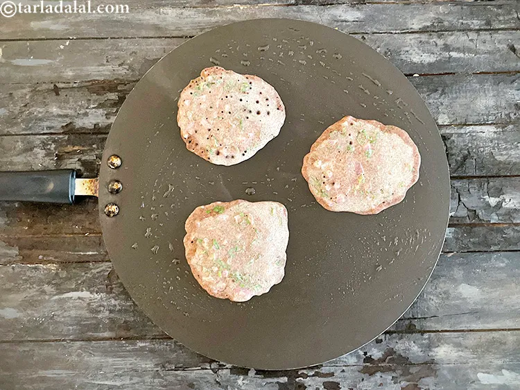 Step 35 – <meta charset="UTF-8" />Let the <strong>nachni uttapam</strong> cook for a while.&nbsp;&nbsp;