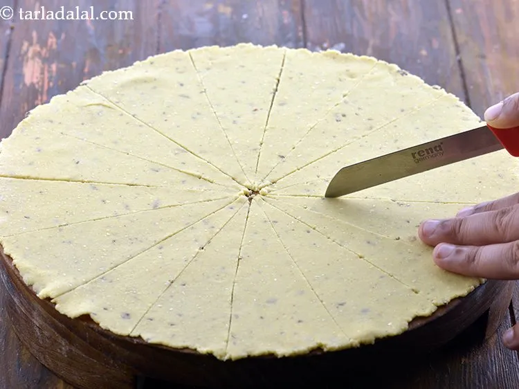 Step 14 – Cut the rolled dough into 16 equal triangles and keep aside.