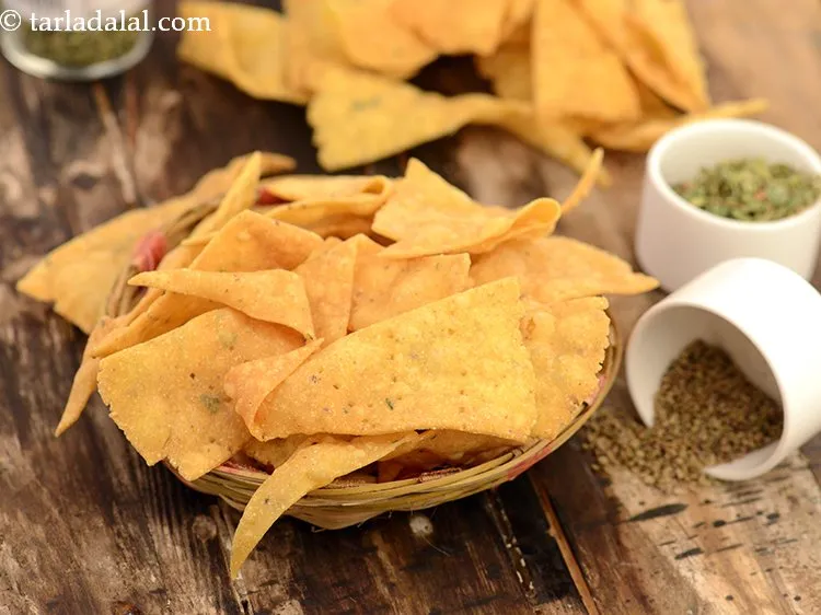 Step 20 – <a href="https://www.tarladalal.com/nacho-chips-2868r" target="_blank">Nacho chips</a> can also be made at home.&nbsp;<br /> &nbsp;