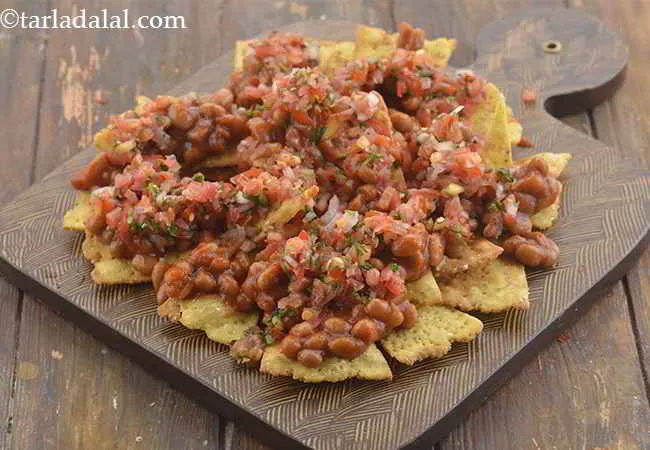 Step 18 – Spread &frac12; portion of the uncooked salsa over it.