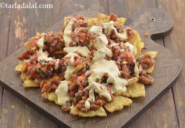 Step 19 – Also pour &frac12; the cheese sauce over it.