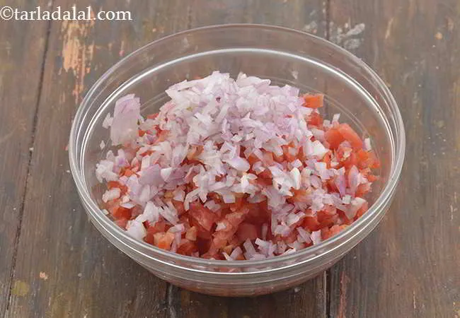Step 3 – Now add the finely chopped onions to it. Combine all the ingredients in a bowl …