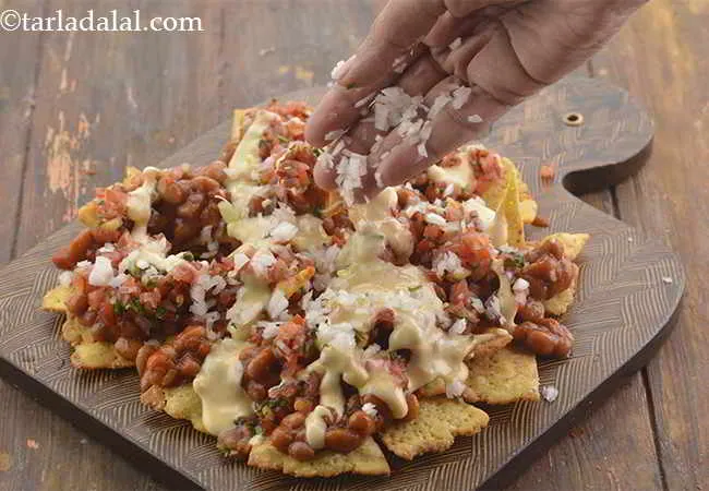 Step 20 – Sprinkle 1 tbsp of spring onion whites on it for crunch.