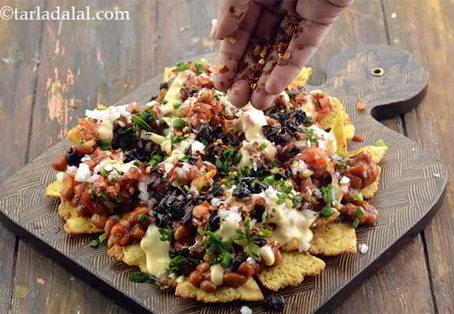 Step 23 – Now add &frac12; tsp dry red chilli flakes over it for a spicy taste.