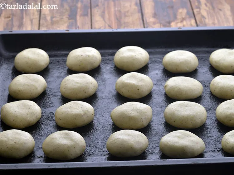Step 17 – Place the&nbsp;<strong>Nankhatai Biscuits</strong>&nbsp;on a baking tray at equal distance. They expand on baking so it …
